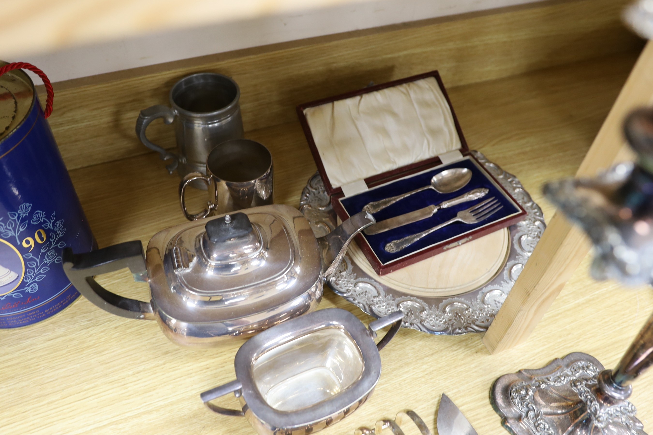 Assorted plated wares including a pair of three light candelabra, 52cms high